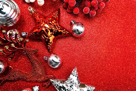 Red Christmas balls decoration ornaments with space copy on Red glitter background;