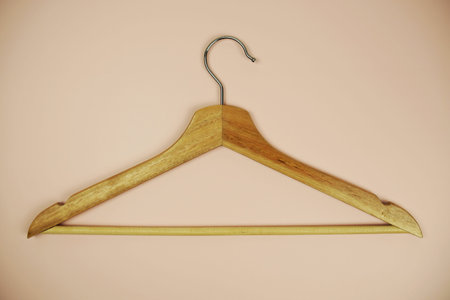 Wooden hanger on pink backgroundの写真素材