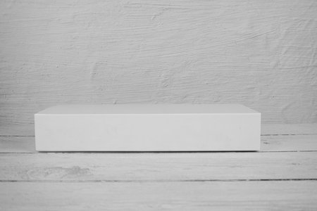 White Podium for product display on wooden backgroundの写真素材