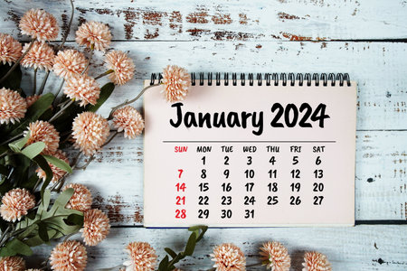 January 2024 monthly calendar with flower bouquet decoration  on wooden backgroundの写真素材