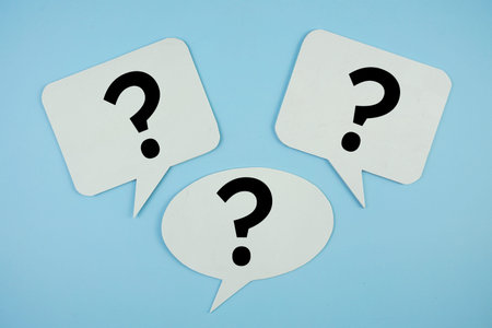 Question Mark with bubble speech top view on blue background
