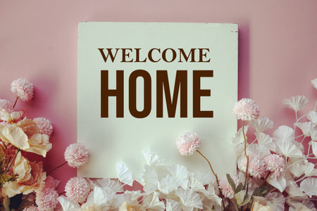 Welcome Home text message with flower decoration on pink backgroundの写真素材