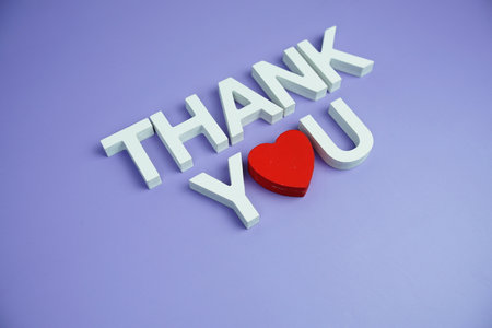 Thank You alphabet letters top view on purple backgroundの写真素材