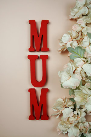 Happy Mother's day theme with MOM letters and flowers decoration on pink backgroundの写真素材