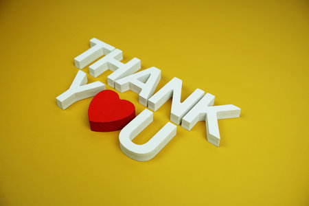 Thank You alphabet letters top view on yellow backgroundの写真素材