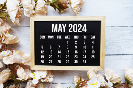 May 2024 monthly calendar with flower bouquet decoration on wooden backgroundの写真素材