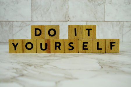 Do It Yourself with wooden blocks alphabet letters on marble backgroundの写真素材