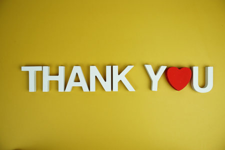 Thank You alphabet letters top view on yellow backgroundの写真素材
