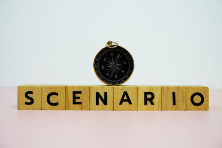 Compass with wooden blocks alphabet letters SCENARIO on pink background