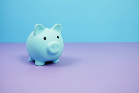 Piggy Bank Saving finance concept on blue and purple background