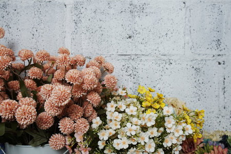 Beautiful flowers frame decoration with space for text message on concrete backgroundの写真素材