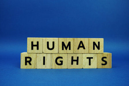 Human Rights alphabet letters with wooden blocks alphabet letters and Gavel on blue background