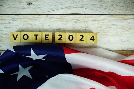 Vote 2024, Presidential Election with USA American flag on wooden backgroundの写真素材