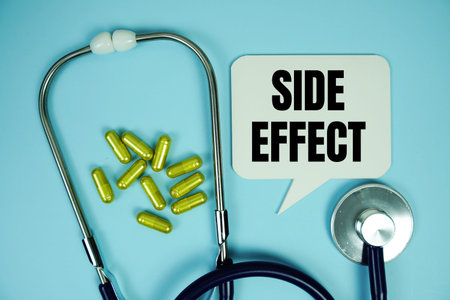 Side Effect text with stethoscope and capsule medicine on blue background, Healthy and wellness...