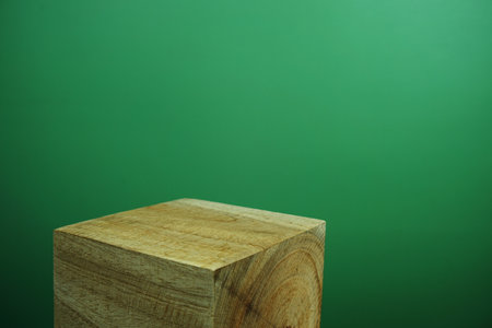 Wooden podium display scene stage showcase front view with copy space on green backgroundの写真素材