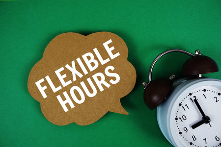 Flexible Hours text on speech bubble with alarm clock on green background