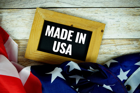 Made in USA text message with USA flag on wooden backgroundの写真素材