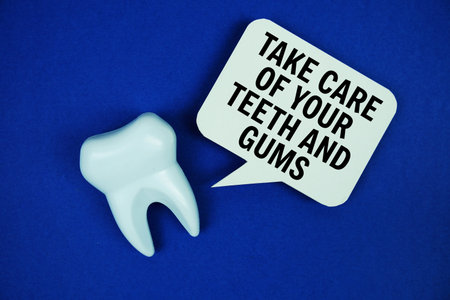 Take Care Of Your Teeth And Gums text on speech bubble with white tooth model on blue background