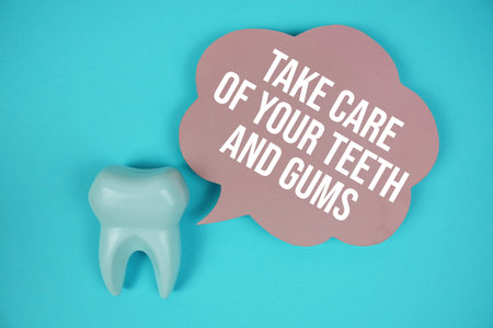 Take Care Of Your Teeth And Gums text on speech bubble with white tooth model on blue background