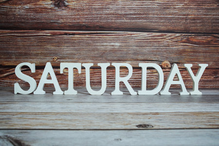 Saturday alphabet letters on wooden backgroundの写真素材