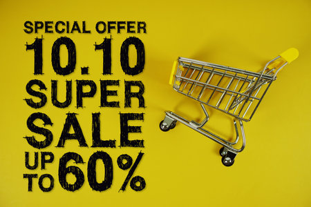 10.10 Super Sale 60% off Special Offer Promotion and trolley shopping cart on yellow backgroundの写真素材