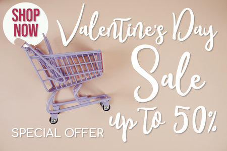 Valentine's Day Sale 50% off Special Offer Promotion and trolley shopping cart on pink backgroundの写真素材