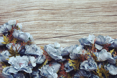 Top view of blue flower frame with space for copy on wooden backgroundの写真素材