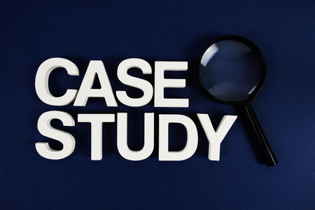 Case Study text message and magnifying glass on navy blue backgroundの写真素材