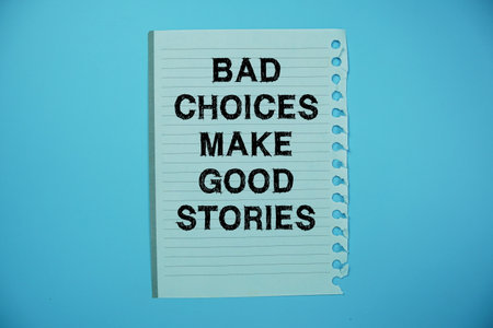 Bad Choices Make Good Stories text written on paper flat lay on yellow backgroundの写真素材