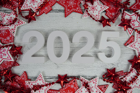 Happy New Year 2025 alphabet letters with Christmas decoration on pink background
