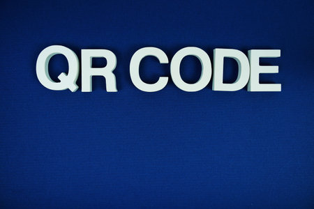 QR Code alphabet letters with space for text top view  on navy blueの写真素材