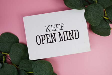 Keep Open Mind Quote text on paper card top view on pink background, Motivation and inspirational...