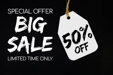 Big Sale 50% off with price tag on black background