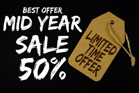 Mid Year Sale 50% with Limited Time Offer on price tag on black background