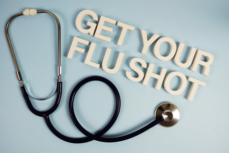 Get Your Flu Shot alphabet letters with stethoscope top view on blue backgroundの写真素材