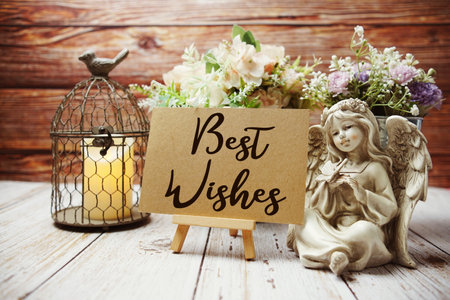 Best Wishes text on paper card with easel and elements decoratedの写真素材