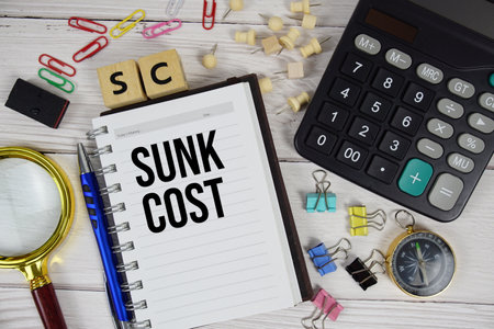 SC - Sunk Cost acronym on notepad, business and financial concept backgroundの写真素材