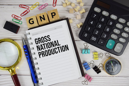 GNP - Gross National Production acronym on notepad, business and financial concept backgroundの写真素材