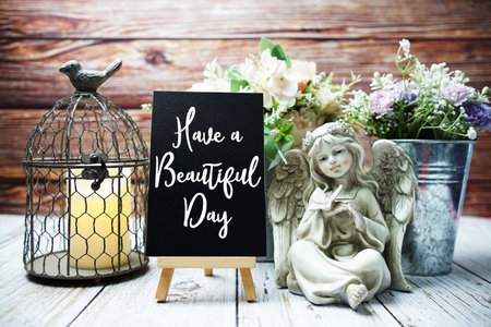 Have a Beautiful Day text on paper card with easel and elements decoratedの写真素材