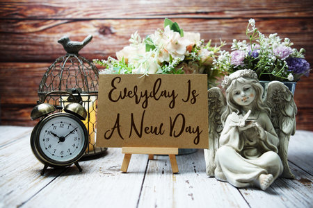 Everyday Is A New Day text on paper card with easel and elements decoratedの写真素材