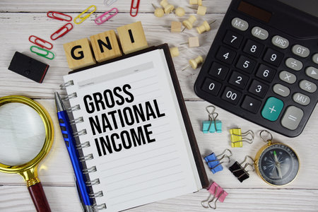 GNI -  Gross National Income acronym on notepad, business and financial concept backgroundの写真素材