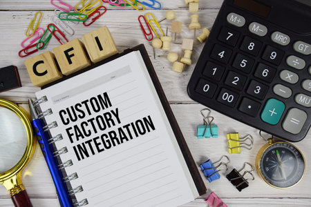 CFI - Custom Factory Integration acronym on notepad, Business and Financial concept