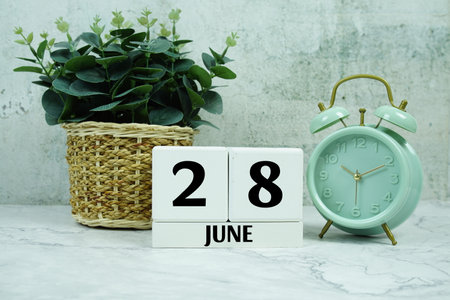 Wooden Calendar Showing the Date of June 28th. Day 28 ofの写真素材