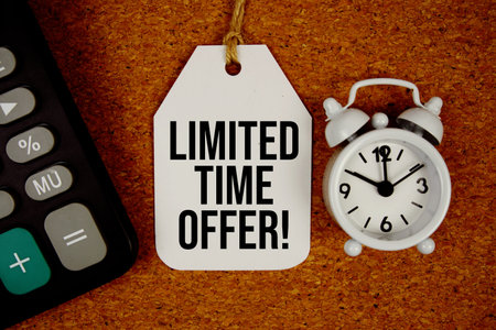 Limtited Time Offer! text on price tag with alarm clock and calculator on cork board background
