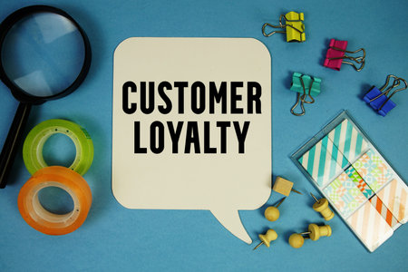Customer Loyalty text with magnifying glass on blue background