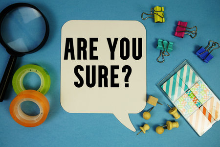 Are You Sure? text with magnifying glass on blue background