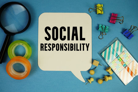 Social Responsibility text with magnifying glass on blue backgroundの写真素材