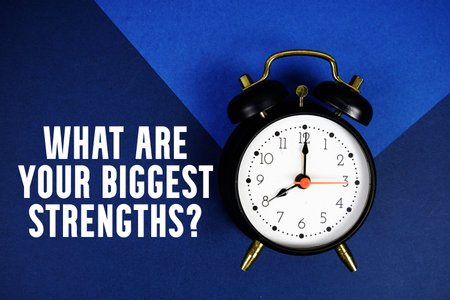 What Are Your Biggest Strengths? text with alarm clock on blue background