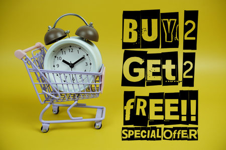 Buy 2 Get 2 Free!! Promotion and Marketing with trolley shopping cart and alarm clock on yellow...