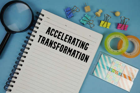 Accelerating Transformation text with magnifying glass on blue backgroundの写真素材